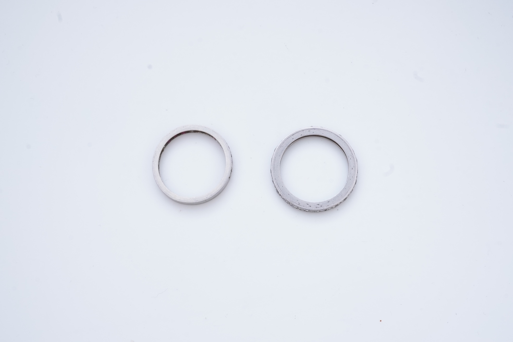 A diamond eternity ring and a ruby and diamond half eternity ring, mid 20th century
